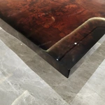 Molten Gold Pedestal Dining Table with Deep Red Burl Wood Top and Inlaid Motif